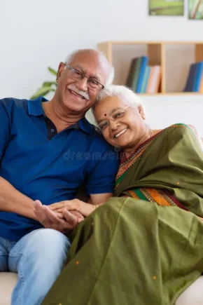 senior-indian-couple-portrait-smiling-looking-camera-48304693