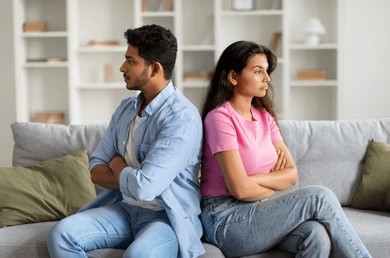 displeased-young-indian-couple-sitting-260nw-2439525053