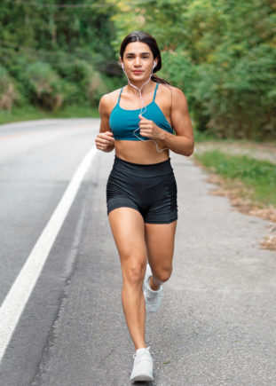 full-shot-fit-woman-running-outdoors