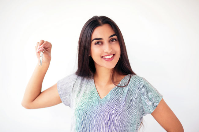 portrait-happy-woman-holding-car-house-keys