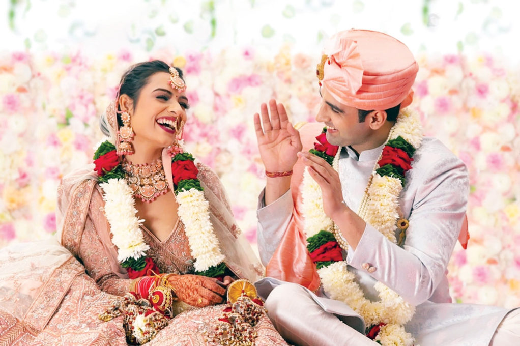 stock-photo-portrait-of-a-happy-indian-wedding-couple-sitting-together-on-mandap-2087404156-transformed