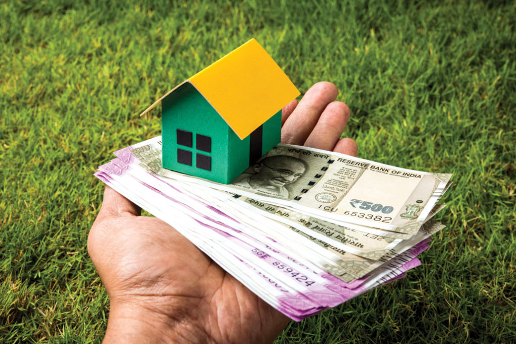 indian-real-estate-business-concept-showing-3d-model-house-with-keys-paper-currency-notes-calculator-selective-focus