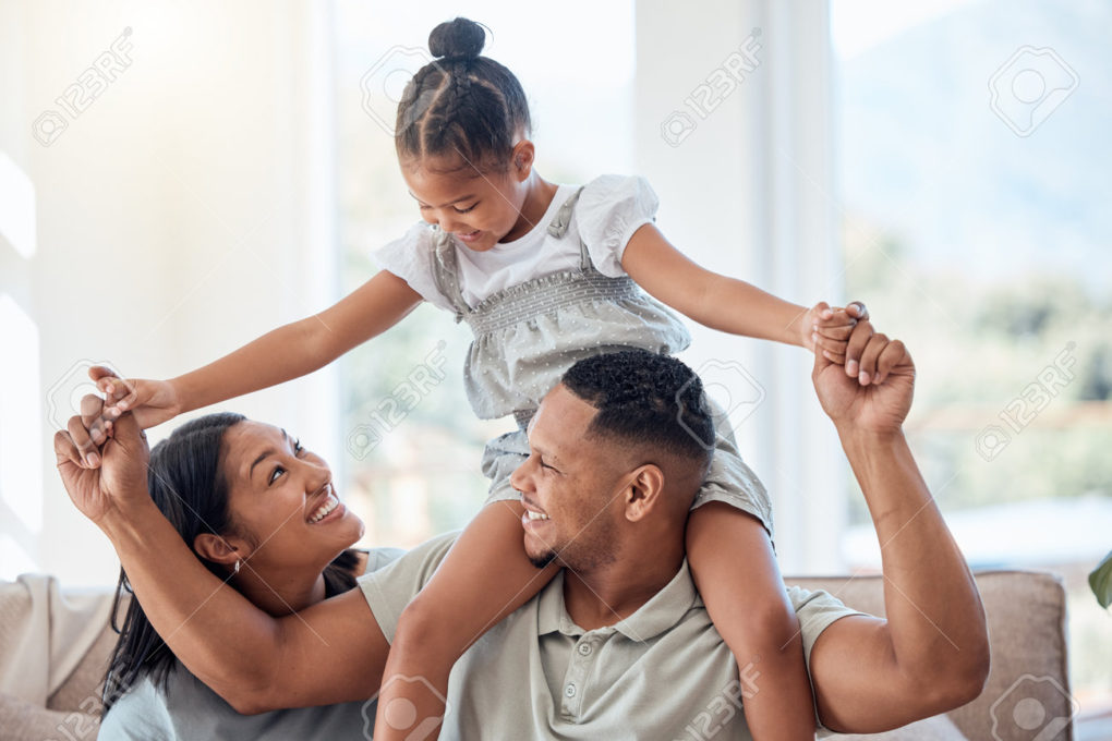 194271434-family-love-and-children-with-a-mother-father-and-daughter-bonding-or-playing-on-a-sofa-in-the