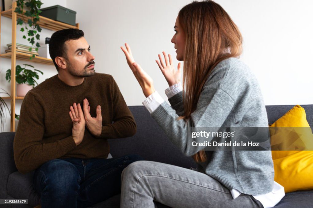 Young couple having an argument. Woman is angry with man. Relationship concept.