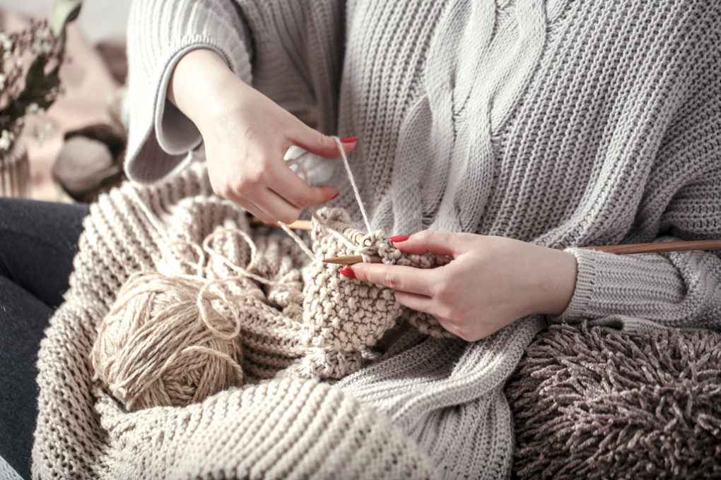 vintage-wooden-knitting-needles-yarn-woman-s-hands