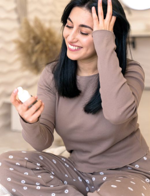 woman-using-spray-hair-her-beauty-routine